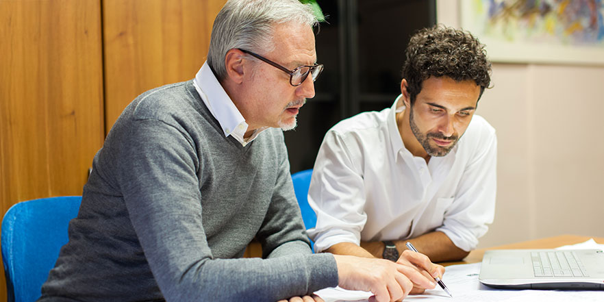 2 business people meeting - Buy a Business Loan