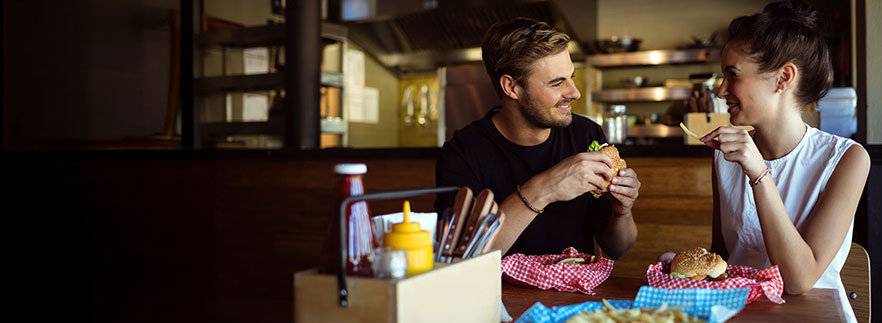 Two people eating at a franchise restaurant - SBA Loan Resources